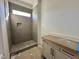 Sleek bathroom showcasing a tiled shower with a built-in niche at 30 Spanish Oak Dr, Youngsville, NC 27596