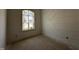 Bright bedroom with large window and modern wall paneling at 30 Spanish Oak Dr, Youngsville, NC 27596