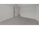 This bedroom features neutral carpet, bright white walls and trim, and easy access to other rooms at 30 Spanish Oak Dr, Youngsville, NC 27596