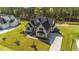 Stunning home with lush green lawn, beautiful landscaping and a long drive leading up to the house at 30 Spanish Oak Dr, Youngsville, NC 27596