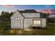 Back exterior view of a two-story home with a screened-in porch at sunset at 30 Spanish Oak Dr, Youngsville, NC 27596