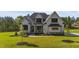 Beautifully landscaped two-story home showcasing modern farmhouse architecture at 30 Spanish Oak Dr, Youngsville, NC 27596