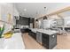 Open-concept kitchen with a center island, stainless steel appliances, and ample counter space at 30 Spanish Oak Dr, Youngsville, NC 27596