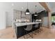 Spacious kitchen with a large island, modern appliances, and stylish pendant lighting at 30 Spanish Oak Dr, Youngsville, NC 27596