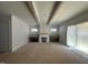 Living room with fireplace and exposed beams at 30 Spanish Oak Dr, Youngsville, NC 27596