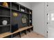 Hall tree featuring shelves, hooks, and a bench near the home's entrance at 30 Spanish Oak Dr, Youngsville, NC 27596