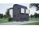 View of a gray two-story home featuring modern design, multiple windows and attached garages at 512 Gordon St # 1102, Durham, NC 27701