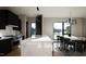 Spacious kitchen featuring white countertops and a dining area with contemporary black chairs and decor at 512 Gordon St # 1102, Durham, NC 27701