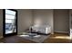 Bright, modern living space featuring a door that leads to an outside patio area, comfortable seating, and hard wood floors at 512 Gordon St # 1102, Durham, NC 27701