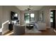 Cozy living room featuring a comfortable sectional sofa, entertainment center, and ceiling fan at 512 Gordon St # 1102, Durham, NC 27701