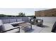 Relax on this rooftop terrace featuring a cozy sectional and comfortable chairs with views at 512 Gordon St # 1102, Durham, NC 27701