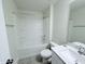 Well-lit bathroom features a tub-shower combo with built-in shelving and a modern vanity at 85 Claude Creek Way, Smithfield, NC 27577