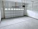 Clean garage with freshly sealed concrete floor, new insulation and updated garage door opener at 85 Claude Creek Way, Smithfield, NC 27577