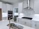 Modern kitchen with stainless steel appliances, white cabinets, and a stylish backsplash at 85 Claude Creek Way, Smithfield, NC 27577