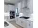 This gourmet kitchen features stainless steel appliances, stylish backsplash, and white cabinets at 85 Claude Creek Way, Smithfield, NC 27577
