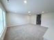 Large living room with neutral carpet, recessed lighting, and plenty of space for entertaining at 85 Claude Creek Way, Smithfield, NC 27577