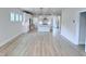 Open floor plan with hardwood floors, kitchen with stainless steel appliances and large living room at 85 Claude Creek Way, Smithfield, NC 27577