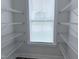 Walk-in pantry with white wire shelving, offering ample storage space at 85 Claude Creek Way, Smithfield, NC 27577