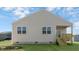 Rear view of new construction home with a covered porch at 15 Back Country Ct, Youngsville, NC 27596