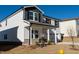 Two-story house with white siding, gray accents, and a two-car garage at 320 Squirrel Oaks Ln, Garner, NC 27529