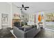 Bright living room featuring a stone fireplace and entryway with coat rack at 5336 Covington Cross Dr, Knightdale, NC 27545