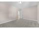 A neutral-toned bedroom features plush carpeting and a doorway that leads to another room at 1029 Whitehall Cir, Durham, NC 27713