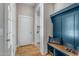 Mud room with custom bench seating and views into laundry at 1029 Whitehall Cir, Durham, NC 27713