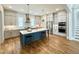 Spacious kitchen with stainless steel appliances, a center island with seating, and abundant counter space at 1029 Whitehall Cir, Durham, NC 27713