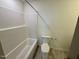Full bathroom with modern shower-tub combo and toilet at 199 Grand Griffon Way, Lillington, NC 27546