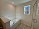 Bright bathroom featuring a soaking tub, tile walls, and a clear glass shower door at 199 Grand Griffon Way, Lillington, NC 27546