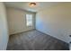 Neutral bedroom offering carpet floors and a window at 199 Grand Griffon Way, Lillington, NC 27546