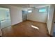 Sunlit bedroom with hardwood floors, ceiling fan, and ample natural light at 199 Grand Griffon Way, Lillington, NC 27546
