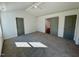 Large bedroom with plush carpeting, multiple closets and doorways, providing ample storage and access to other rooms at 199 Grand Griffon Way, Lillington, NC 27546