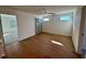Large bedroom with hardwood flooring, neutral paint, a ceiling fan, and a closet at 199 Grand Griffon Way, Lillington, NC 27546