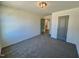 Bedroom with carpet, featuring neutral paint, and grey door at 199 Grand Griffon Way, Lillington, NC 27546