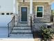Close up view of the covered front porch with stone accents and an 