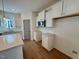 Bright kitchen featuring stainless steel appliances, island, and white cabinets at 199 Grand Griffon Way, Lillington, NC 27546