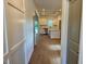Spacious kitchen with stainless steel appliances, an island, white cabinets, and hardwood floors at 199 Grand Griffon Way, Lillington, NC 27546