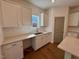 Modern kitchen with white cabinets, quartz countertops, and island at 199 Grand Griffon Way, Lillington, NC 27546