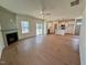 Open living room features hardwood floors, fireplace, and access to back patio at 199 Grand Griffon Way, Lillington, NC 27546