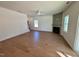 Spacious living room boasts hardwood floors, a fireplace, and plenty of natural light from the windows at 199 Grand Griffon Way, Lillington, NC 27546