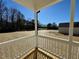 View from porch shows backyard and treed area at 199 Grand Griffon Way, Lillington, NC 27546