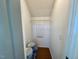 Small storage room with a white wire shelf, white walls, and gray storage containers at 199 Grand Griffon Way, Lillington, NC 27546