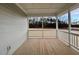 Screened porch with wood flooring and wooded views at 217 Grand Griffon Way, Lillington, NC 27546