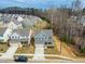 A stunning aerial view captures a desirable neighborhood with meticulously maintained homes and picturesque landscaping at 313 Mason Oaks Dr, Wake Forest, NC 27587