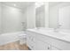 Bright bathroom featuring double sinks, modern finishes, and shower-tub combo at 313 Mason Oaks Dr, Wake Forest, NC 27587