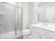 Bright bathroom features a stand up shower with glass doors and a white sink at 313 Mason Oaks Dr, Wake Forest, NC 27587