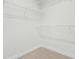 Walk-in closet featuring wire shelving and neutral colored carpet at 313 Mason Oaks Dr, Wake Forest, NC 27587
