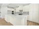 Spacious kitchen features white cabinets, stainless steel appliances, and an island at 313 Mason Oaks Dr, Wake Forest, NC 27587