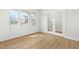 Bright room with hard wood floors and large windows for natural light; glass doors at 313 Mason Oaks Dr, Wake Forest, NC 27587